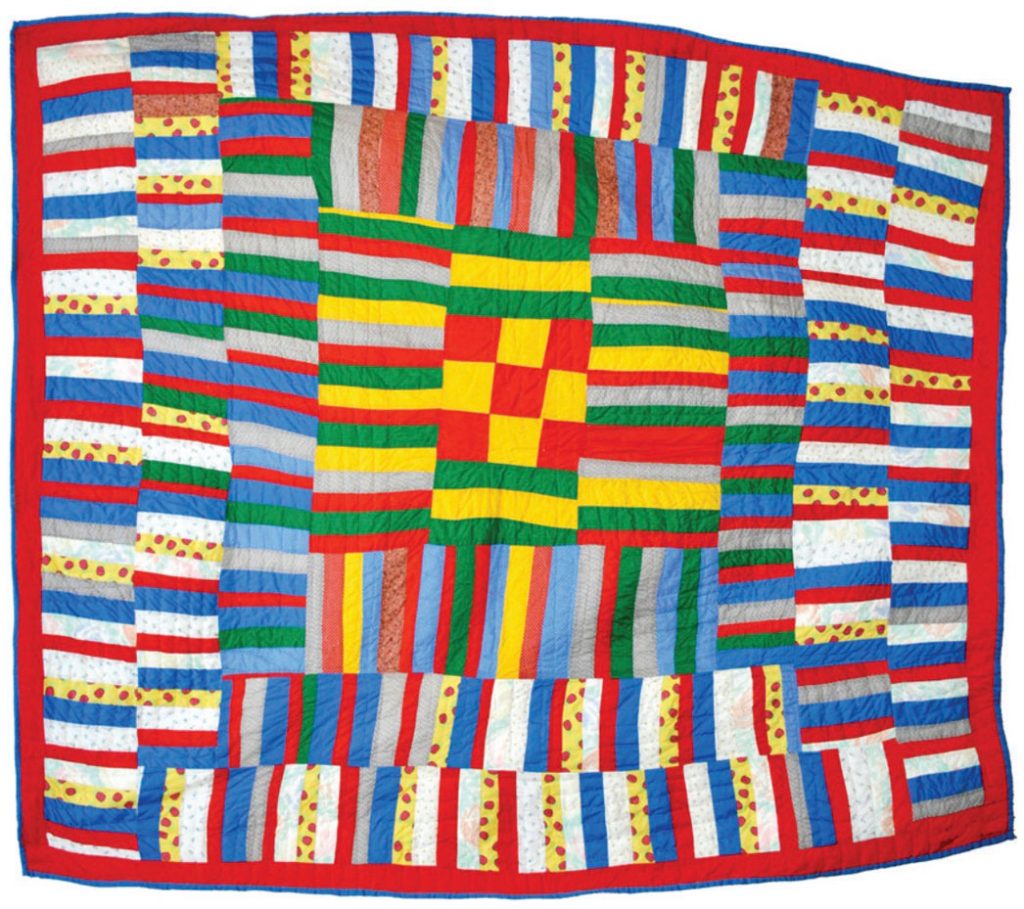 Photo of a bright quilt with rectangular patterns