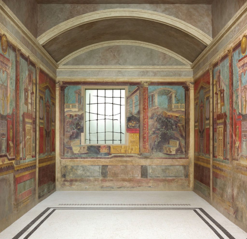 Image of bedroom painted with landscape and architectural views and columns on walls.