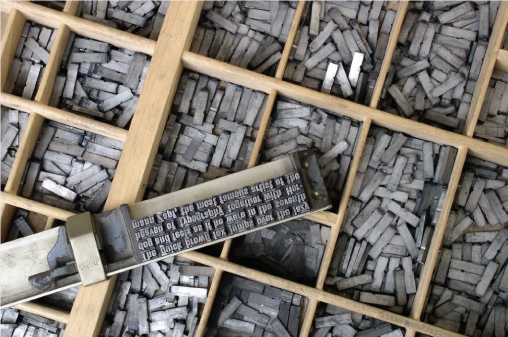 Photo of a box of movable type used for printing press.