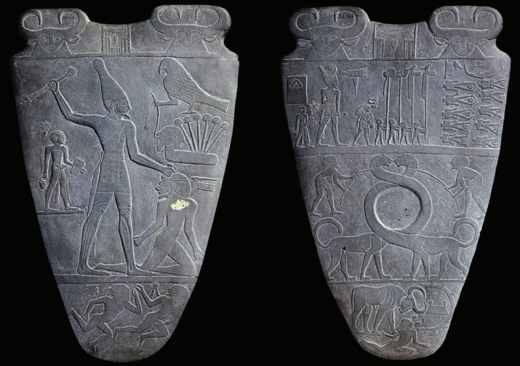 Photo of relief carvings of subjugation of the enemy by an Egyptian king, watched by deities.