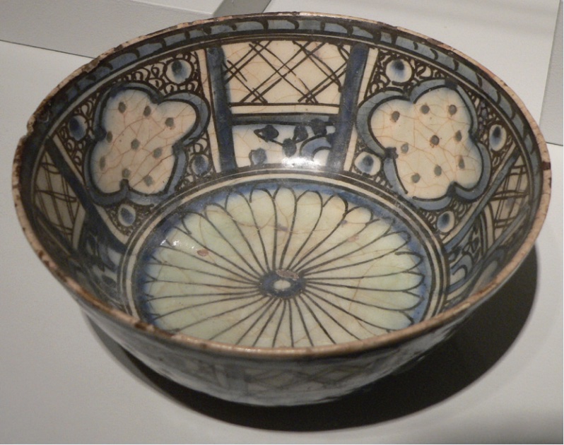 Photo of a bowl with designs in blue and black.