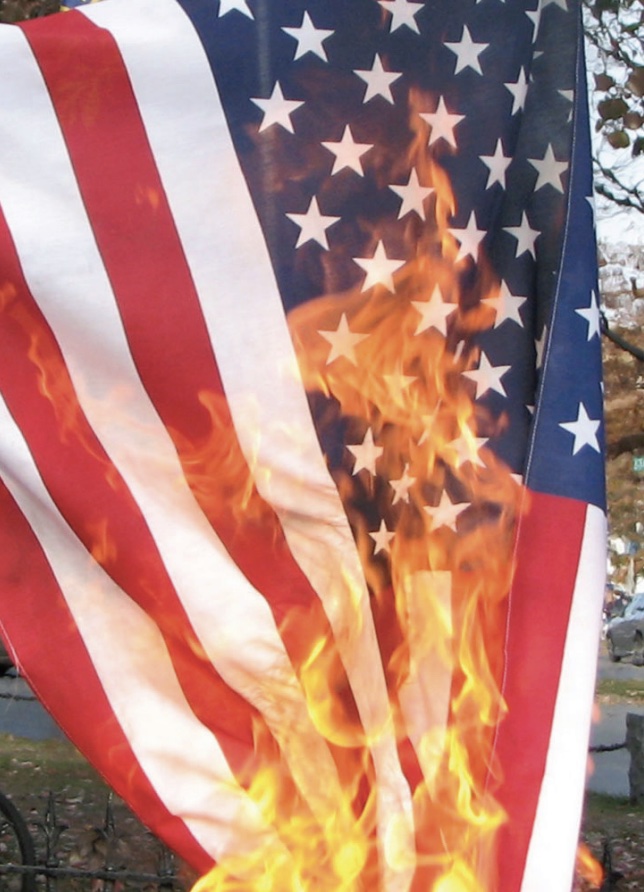 Photo of US flag being burned.
