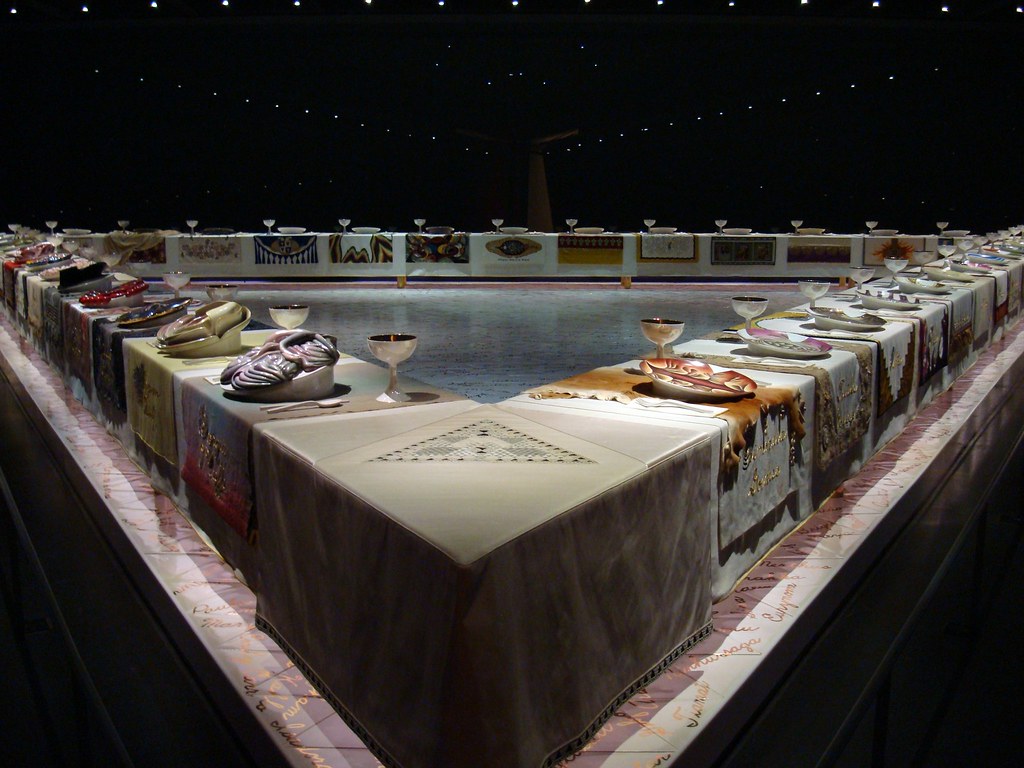 A traiangular shaped dinner table.