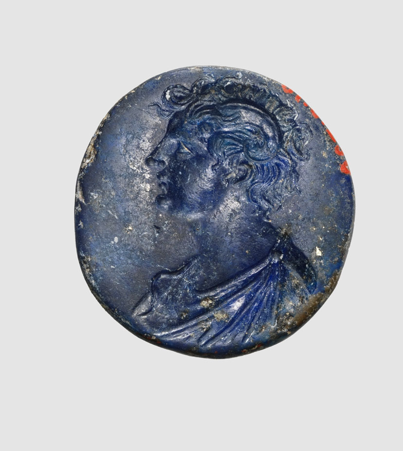 Image of Intaglio relief example, Lapis Lazuli. The image is cut into the stone.