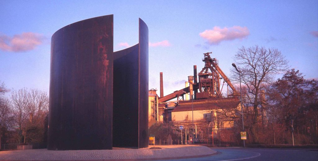 Image of The Tilted Arc by Richard Serra. Long cor-ten steel plate installed in Foley Federal Plaza in Manhattan.