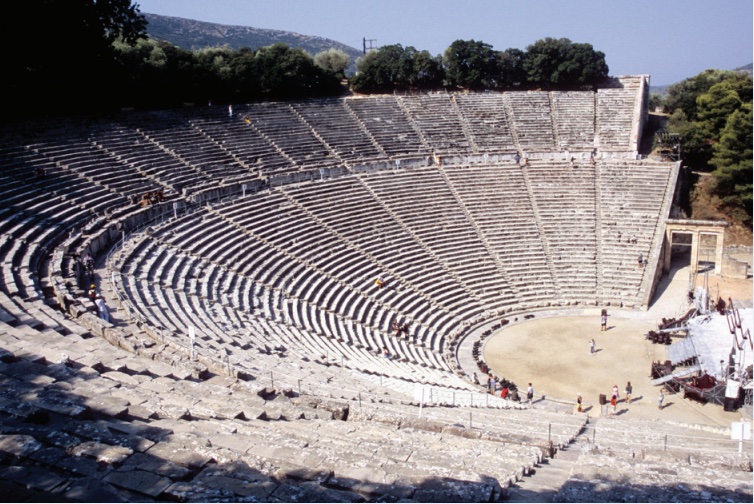 Photo of a large outdoor theater with seating in a semi-circle.