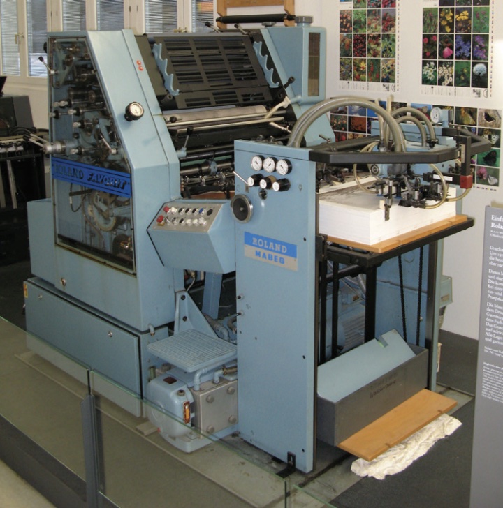 Photo of lithographic press in print shop or lab space.