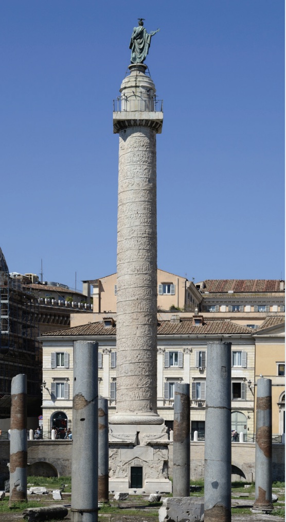 Photo of Column of Trajan within residential area in city.