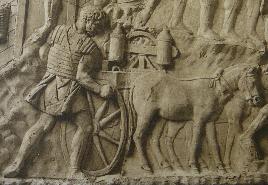 Photo of closeup of Column of Trajan depicting scene of warrior preparing horse with wagon.