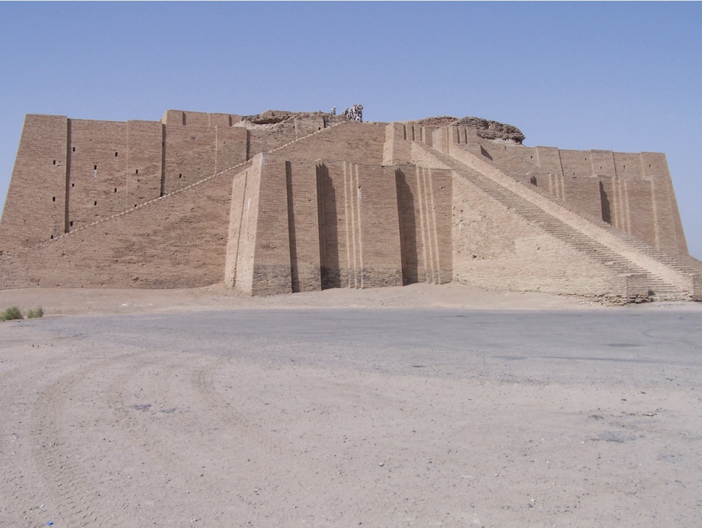 Photo of a structure made of stone or brick, resembling a mountain with a temple at summit.