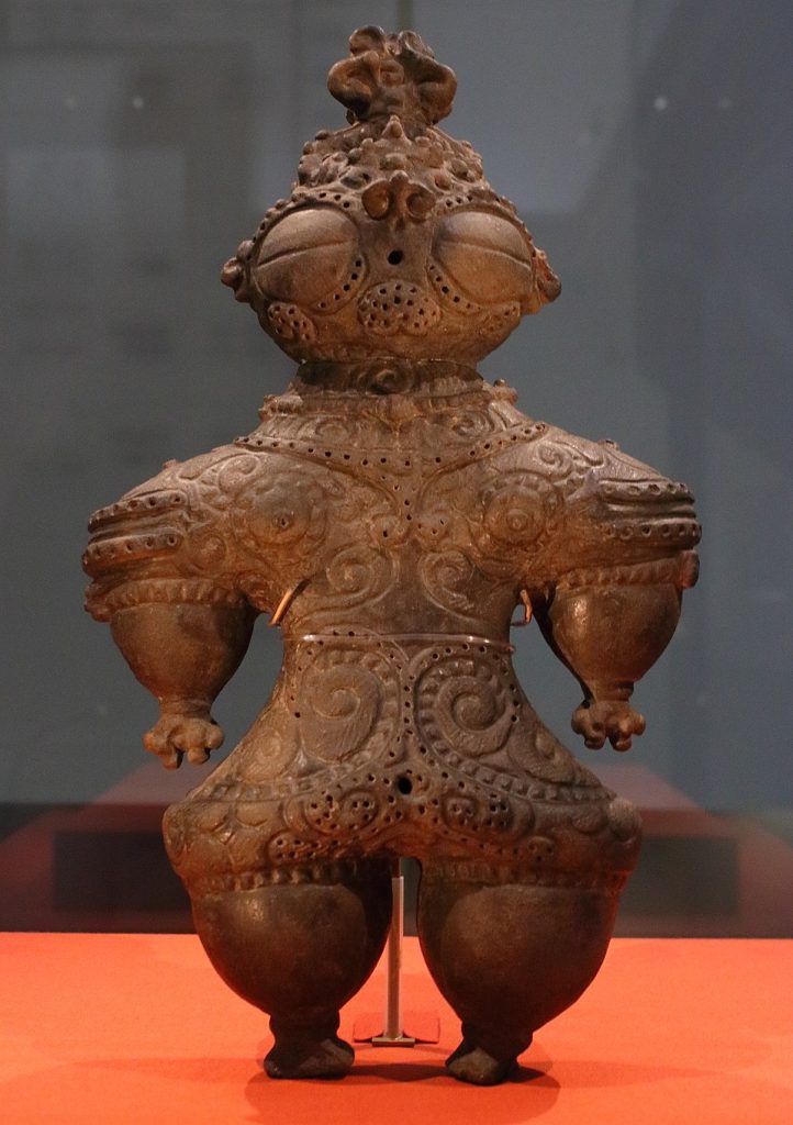 Dogu figurine with goggle-shaped eyes.