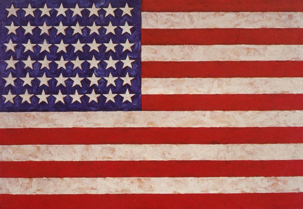 Image of Flag by Jasper Johns. The American flag painted using encaustic, oil and as a collage on fabric mounted on plywood.