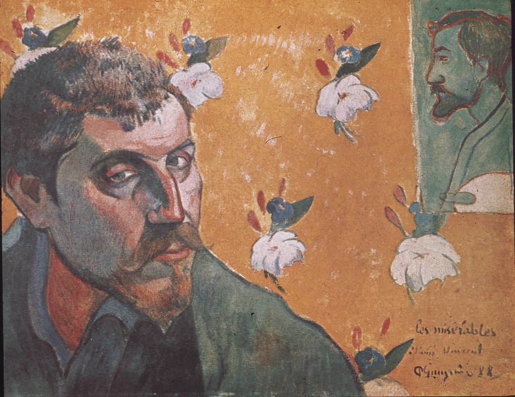 A self-portrait of Gauguin against a wall with orange floral wallpaper with another self portrait taped to the wall.