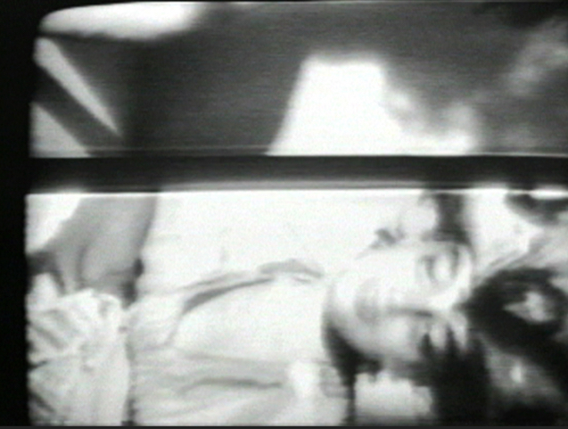 A still from Vertical Roll showing the face of the artist.