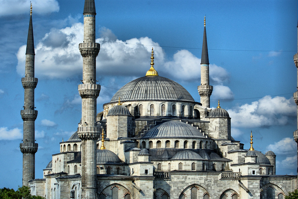 Exterior view of the Blue Mosque shoing the intricate domes and 3 minarets.