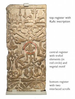 The Dado panel with noes showing the Kufic inscription in the top register, trefoil and vegetal elements in the central register, sand two interlaced scrolls in the bottom register.