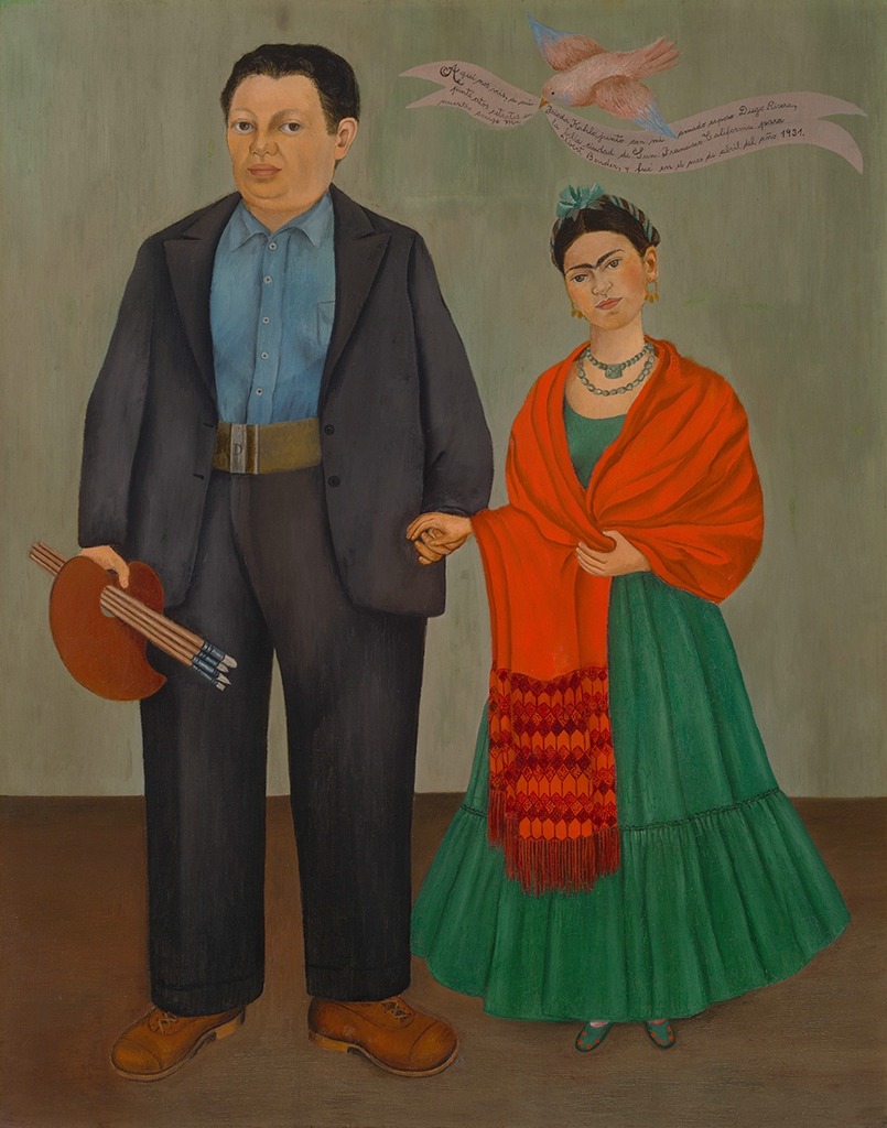 A self-portrait o fFrida Kahlo and her husband Diego Rivera holding hands. Diego holds a palette and some paint brushes. Firda is dressed in tradition Mexican dress with a large shawl. A bird over their heads holds a banner written in Spanish.