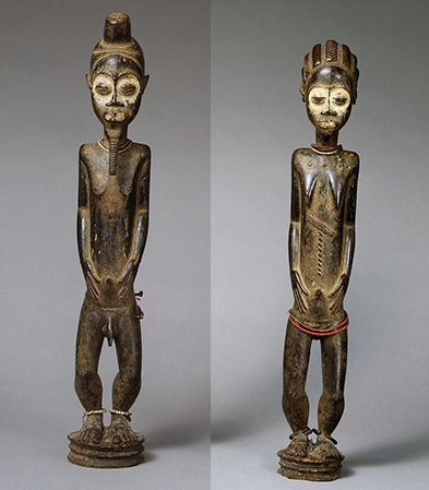 Male and female statues showing tribal figures with body art, bead adornment, and painted faces.