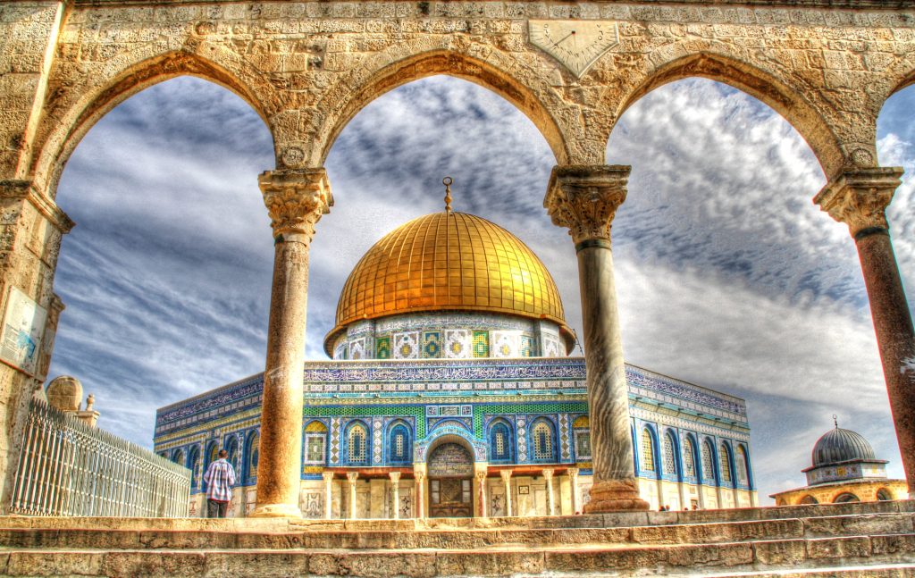 Image of The Dome of the Rock (Qubbat al-Sakhra). Shown is the golden dome with elaborate blue color exterior.