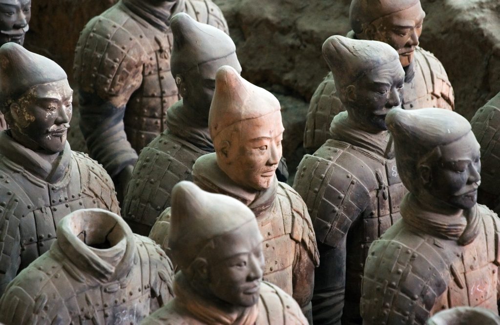 Close view of Terracotta Warriors. Detail of their faces and armour.