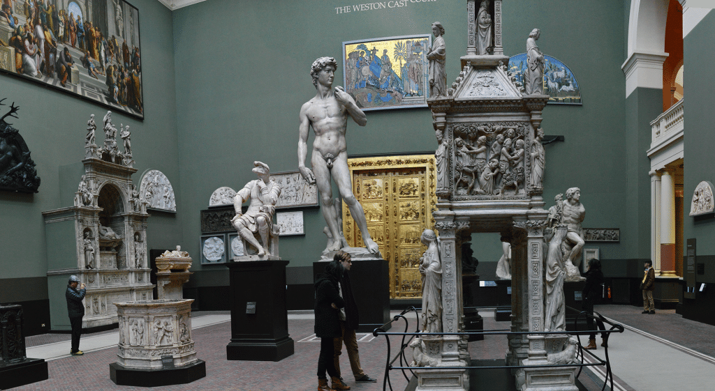 A museum room displying sculpture casts.