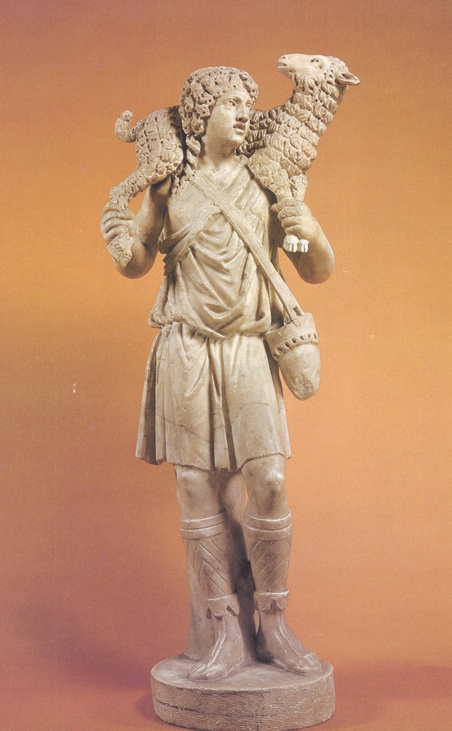 Image of statue The Good Shepherd. Young boy carrying a lamb over his shoulders.