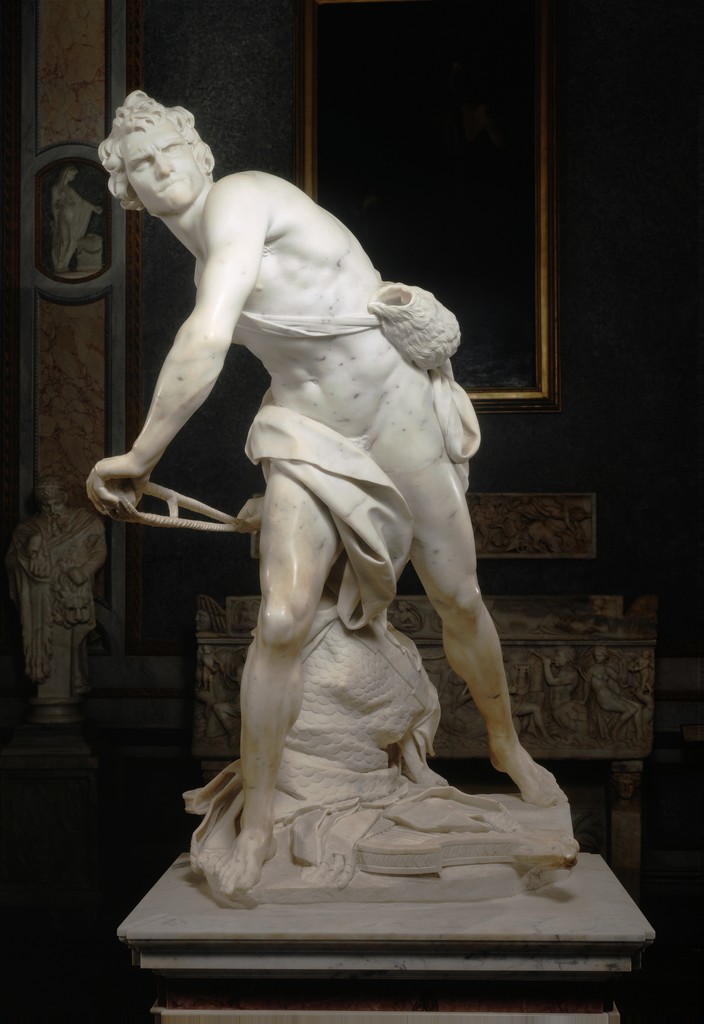 Marble sculpture of David by Gian Lorenzo Bernini. David is depicted about to throw the stone that will bring down Goliath and therefore behead him.