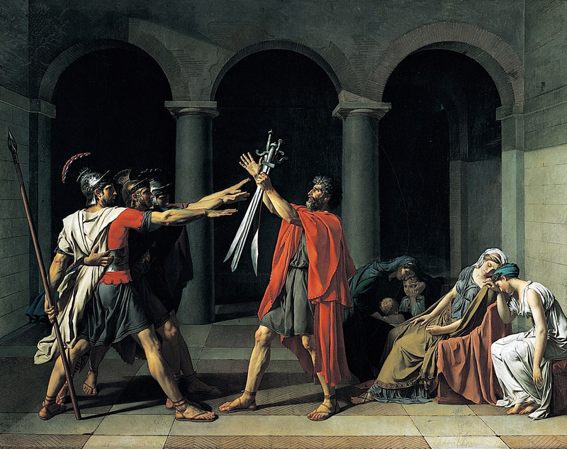 Image of Oath of the Horatii by Jacques-Louis David.Depicted are the three Horatii brother taking an oath before their father (center) that holds three swords for each of them. To the right are two women and a woman with child.