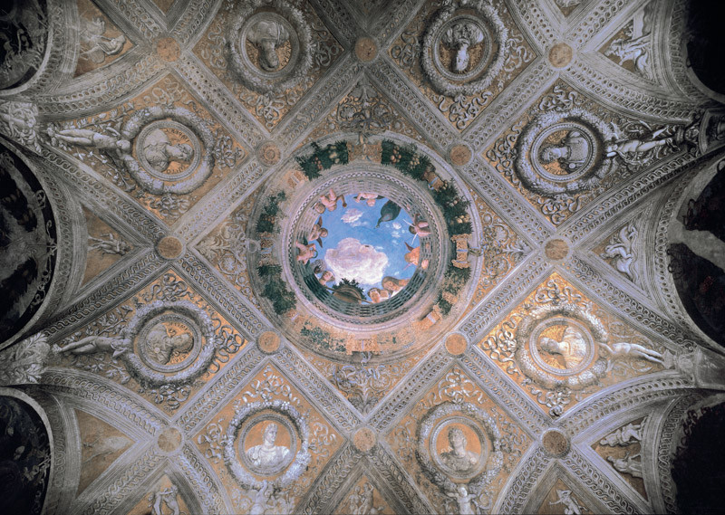 Ceiling vault decorated with busts of Roman emperors and the oculus open on a cloudy sky, ringed with female figures and flying putti looking down.