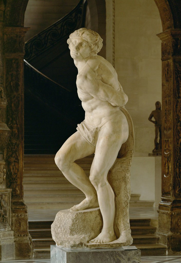 Statue of a nude man, hands behind his back, standing with one knee up.