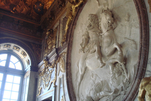 Image of Equestrian Relief of King Louis XIV by Antoine Coysevox. Grand Medallion depicting the victory of Louis XIV over the enemies of France. From Salon de la Guerre in Versailles.