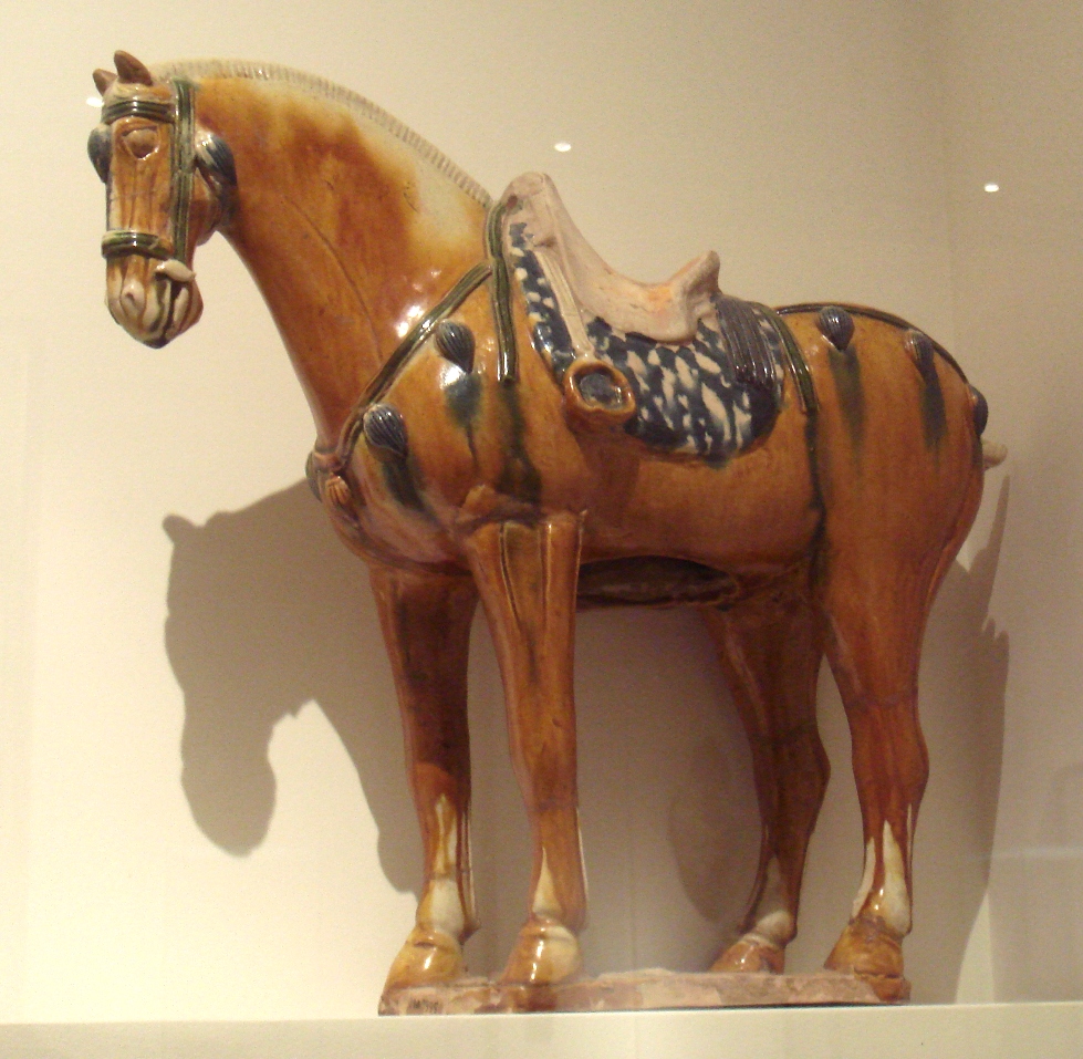 A ceramic horse with saddle.
