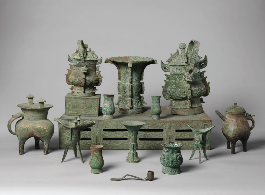Photo of set of bronze objects used as vessels for food and wine.