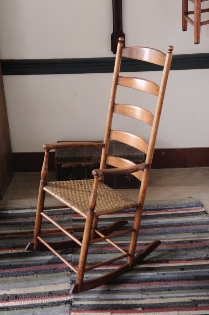 Photo of wooden rocker constructed by Shakers and simplistic and functional in nature.