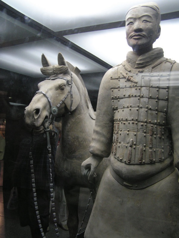 Photo of statue showing soldier next to his horse.