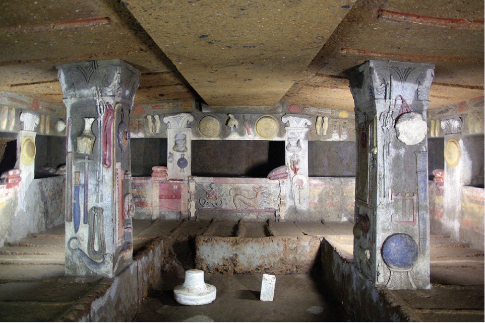 Photo of decorated chambers of a tomb with painted walls.