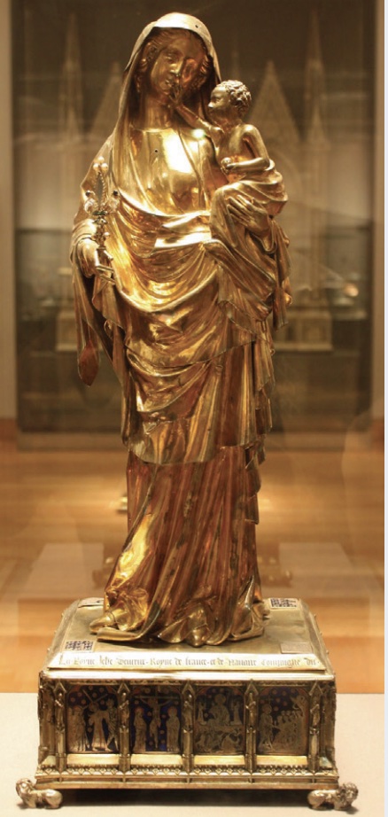 Photo of a gold sculpture of the virgin mary with baby in arms.