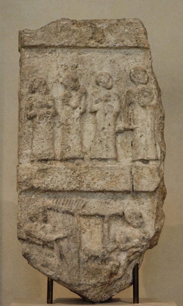 Photo of music stele showing Gudea with attendants in one register and musicians below.