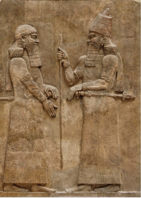 Image of relief art and image of a king with attendant in costume and headgear.